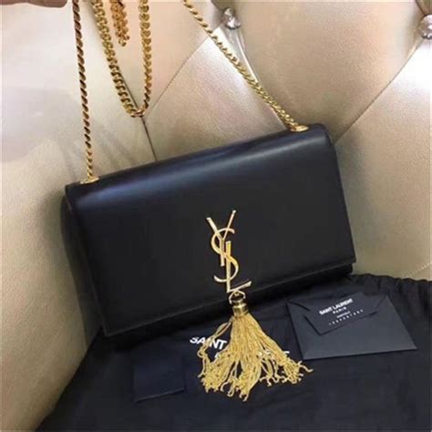 ysl black crossbody with tassel.